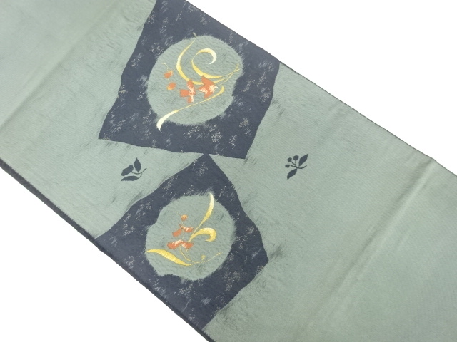 丸文に抽象花模様織出し名古屋帯